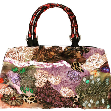 Art print of a handmade purse titled Hanging Gardens of Babylon, created by Sara Palacios with embroidered lace, sequins, and rich textile textures.
