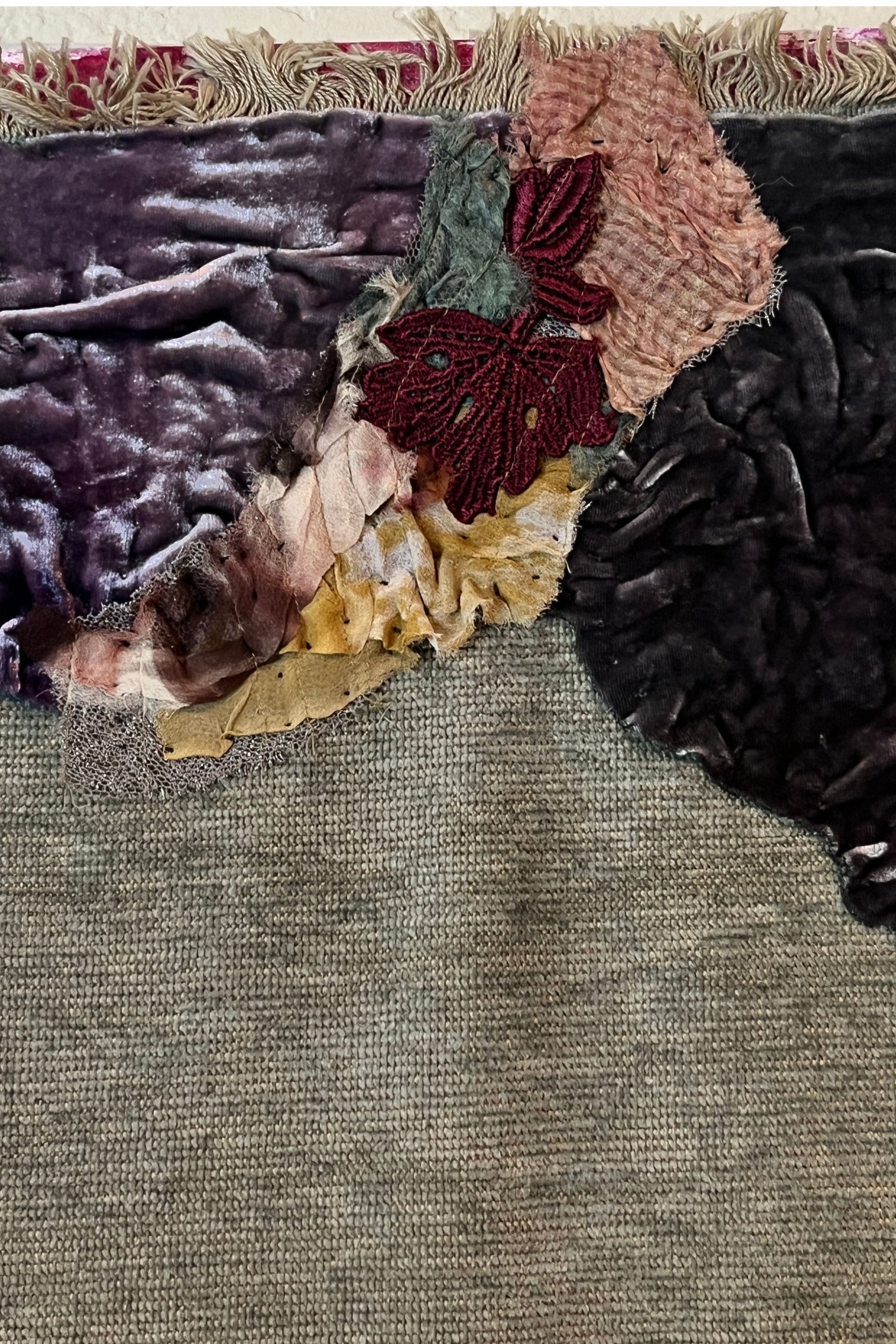 Textured fabric with floral patterns on a neutral background