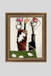 Framed abstract artwork with two figures on a beige background