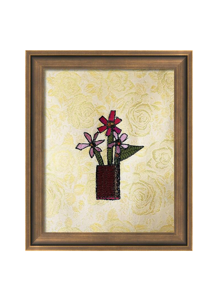 Framed artwork of flowers on a floral background
