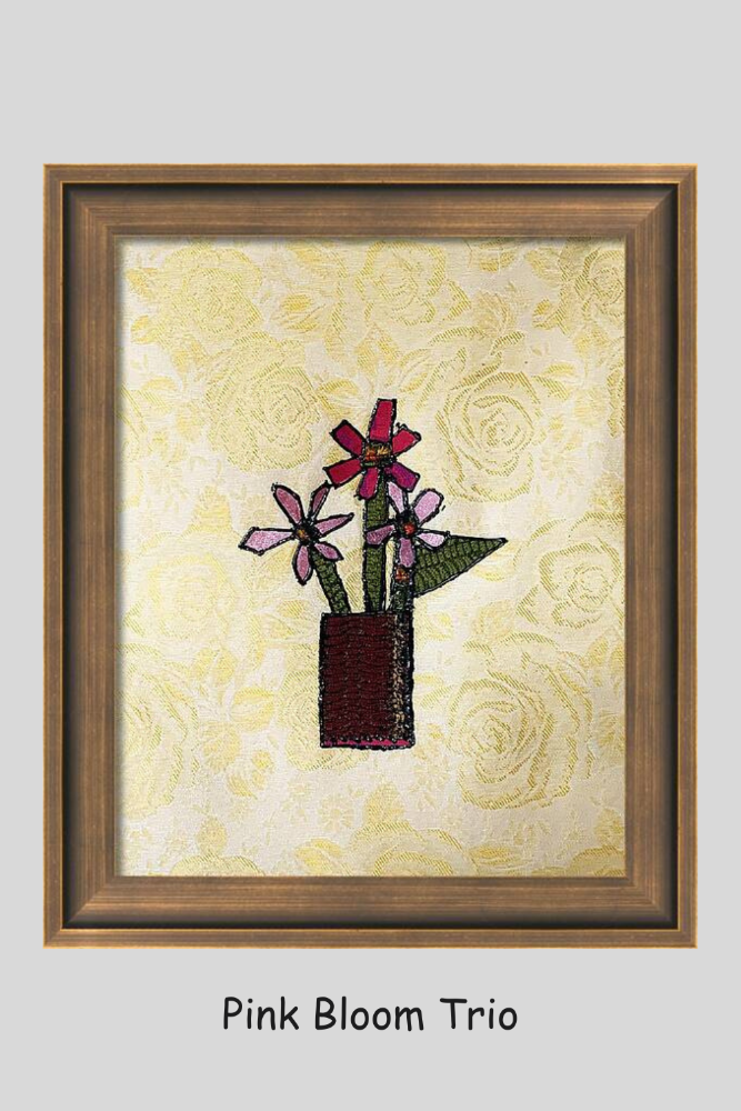 Framed artwork of pink flowers in a pot on a yellow floral background
