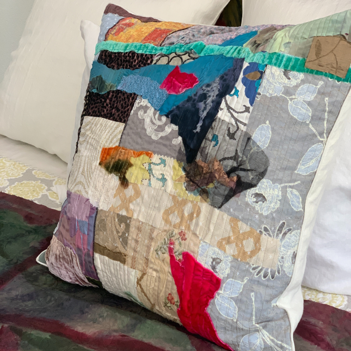 Colorful patchwork pillow on a sofa