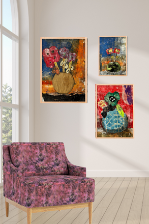 Colorful abstract paintings on a wall with a floral-patterned chair below.
