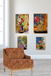 Decorative armchair with floral artwork on a wall