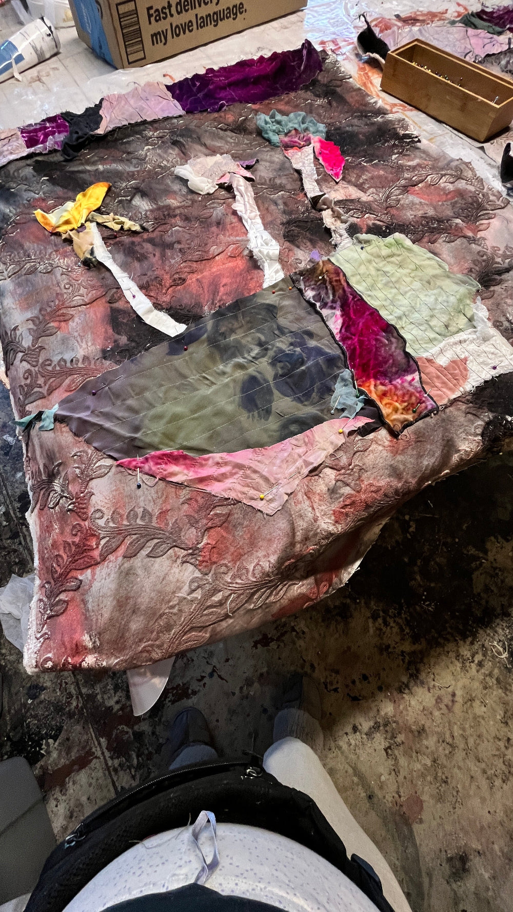 process of a textile art collage, abstract flowers on a abstract vase
