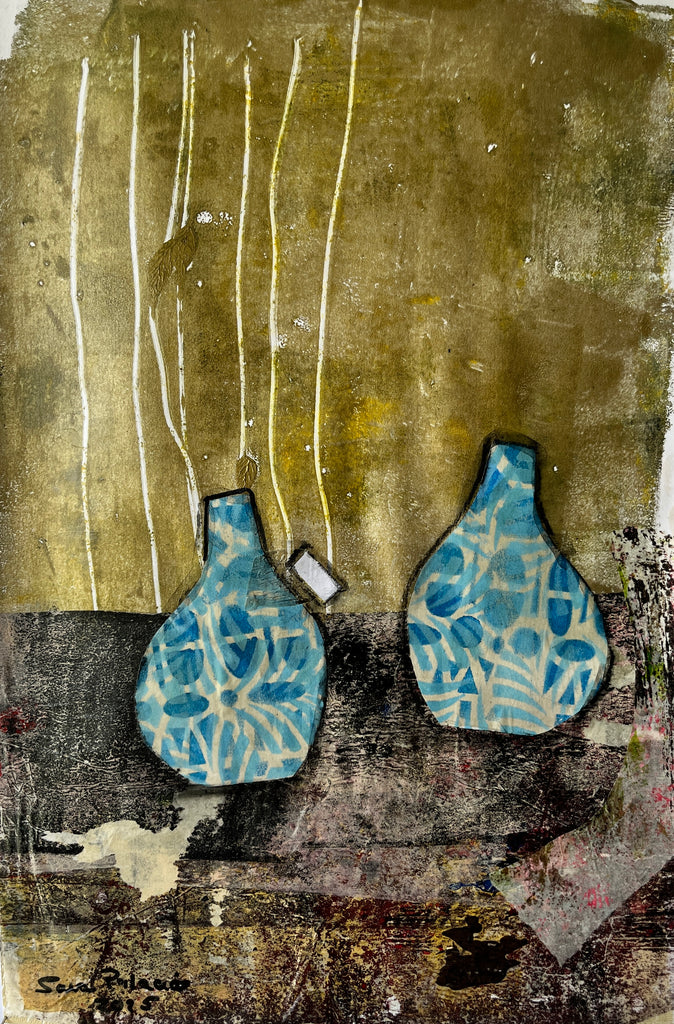 Two blue ceramic vases on a textured surface with abstract patterns