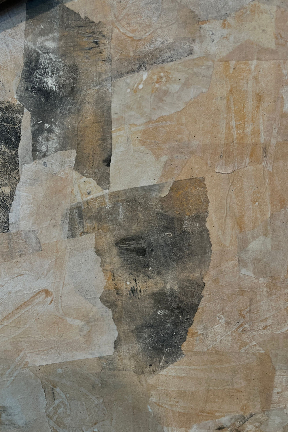 Close-up of a stone wall with various shades of brown and gray.