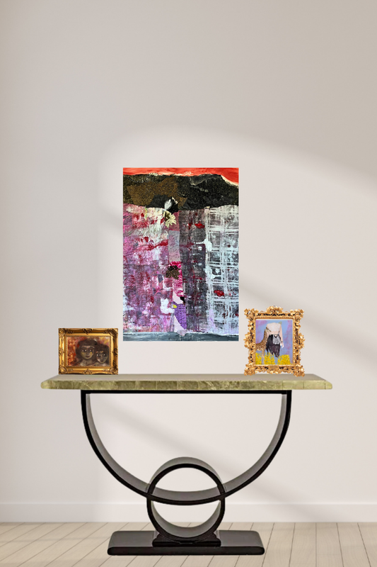Textile art on top of a modern metal table with two framed art pieces on the mantel