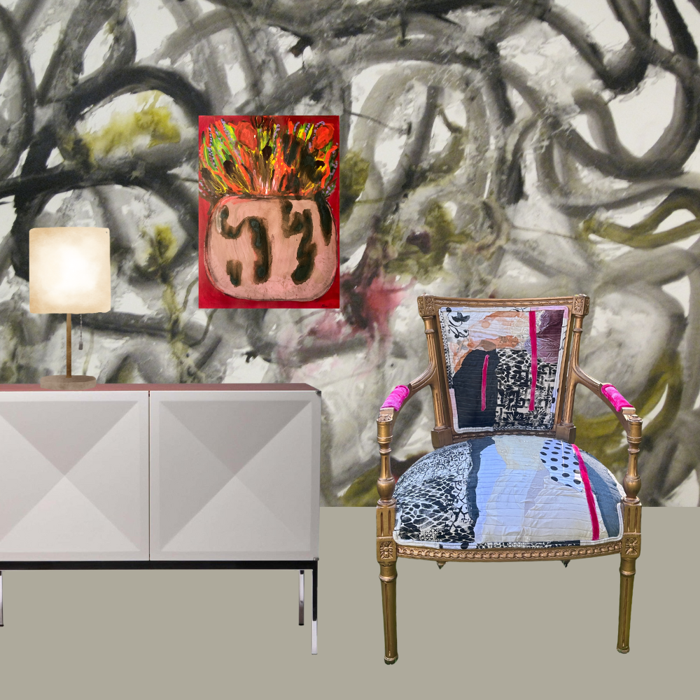 Decorative chair with colorful cushion in front of abstract wall art