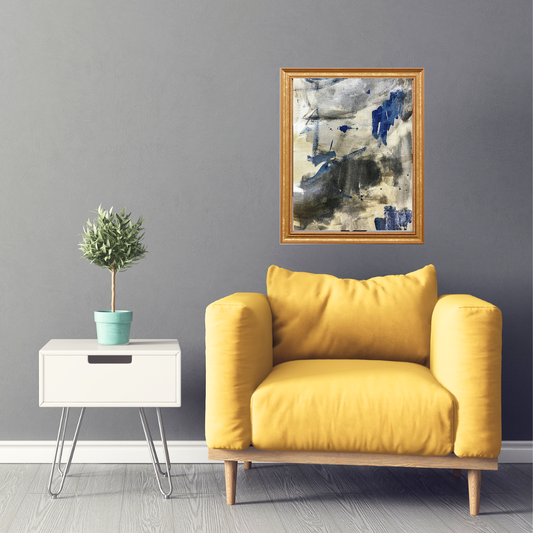 Yellow armchair in a room with a abstract painting on the wall and a small table with a plant.