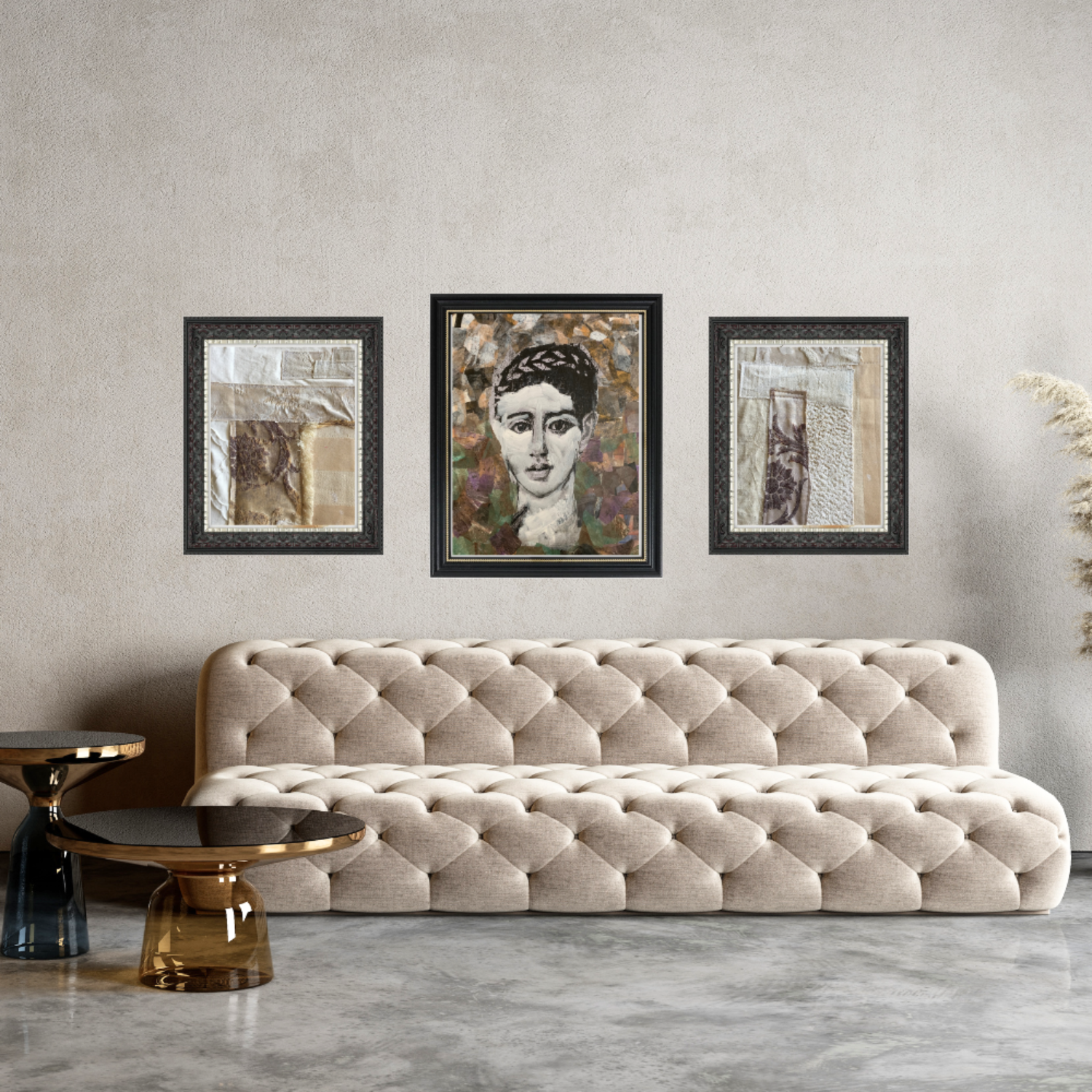 Beige tufted sofa in a room with three framed artworks on the wall.