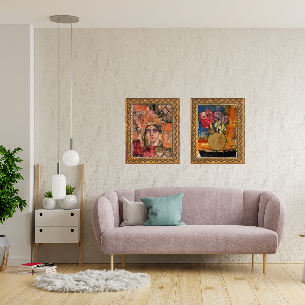 Wall art. Living room with a pink sofa, decorative pillows, and two framed artworks on the wall.