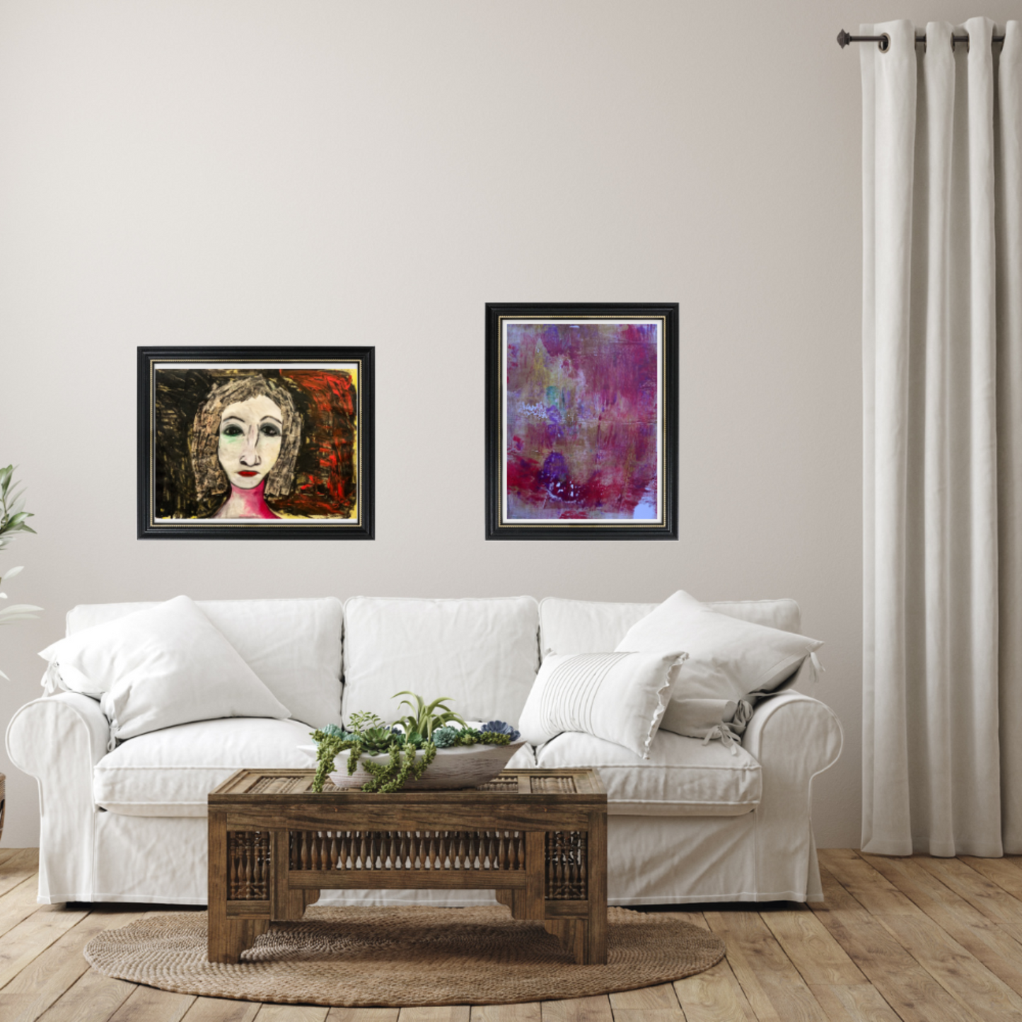 Wall art. Living room with a white sofa, wooden coffee table, and two framed artworks on the wall.