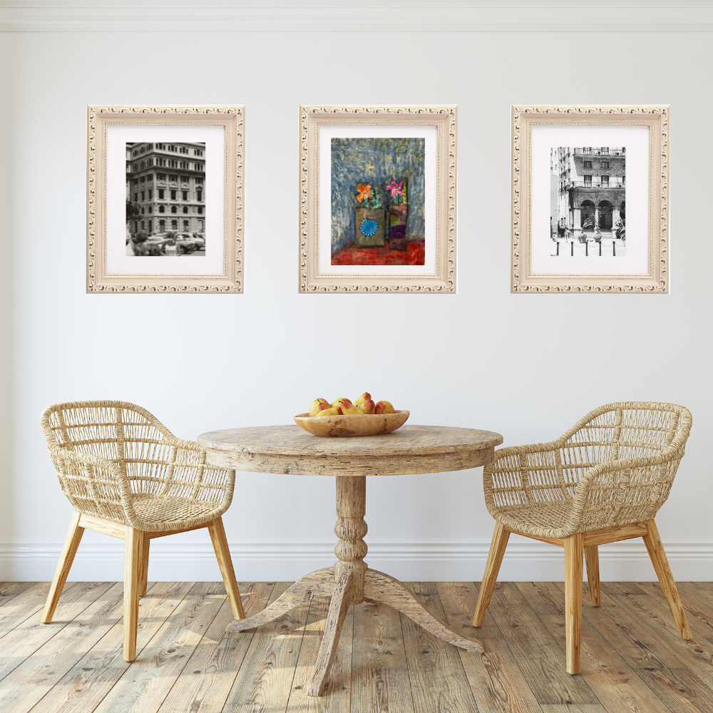 Floral Wall Fine Art Print. Dining room with a wooden table and wicker chairs, framed artwork on the wall.