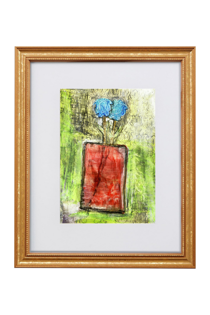 Framed abstract artwork with a red square and blue circles on a green background
