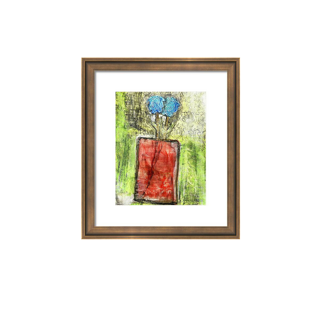 Framed abstract artwork with blue and red elements on a white background