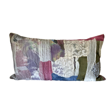 Multicolored patterned pillow on a white background