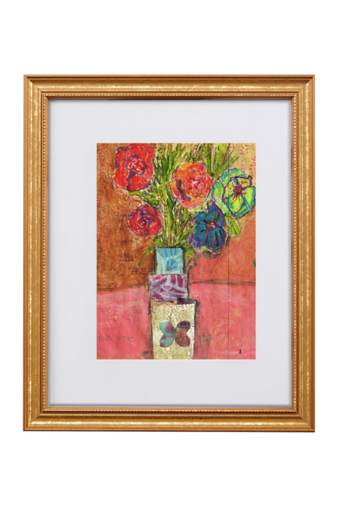 Framed artwork of colorful flowers on a white background