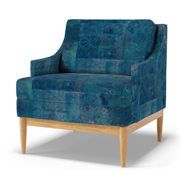Blue patterned armchair with wooden legs on a white background