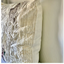Close-up of textured white pillows on a neutral background