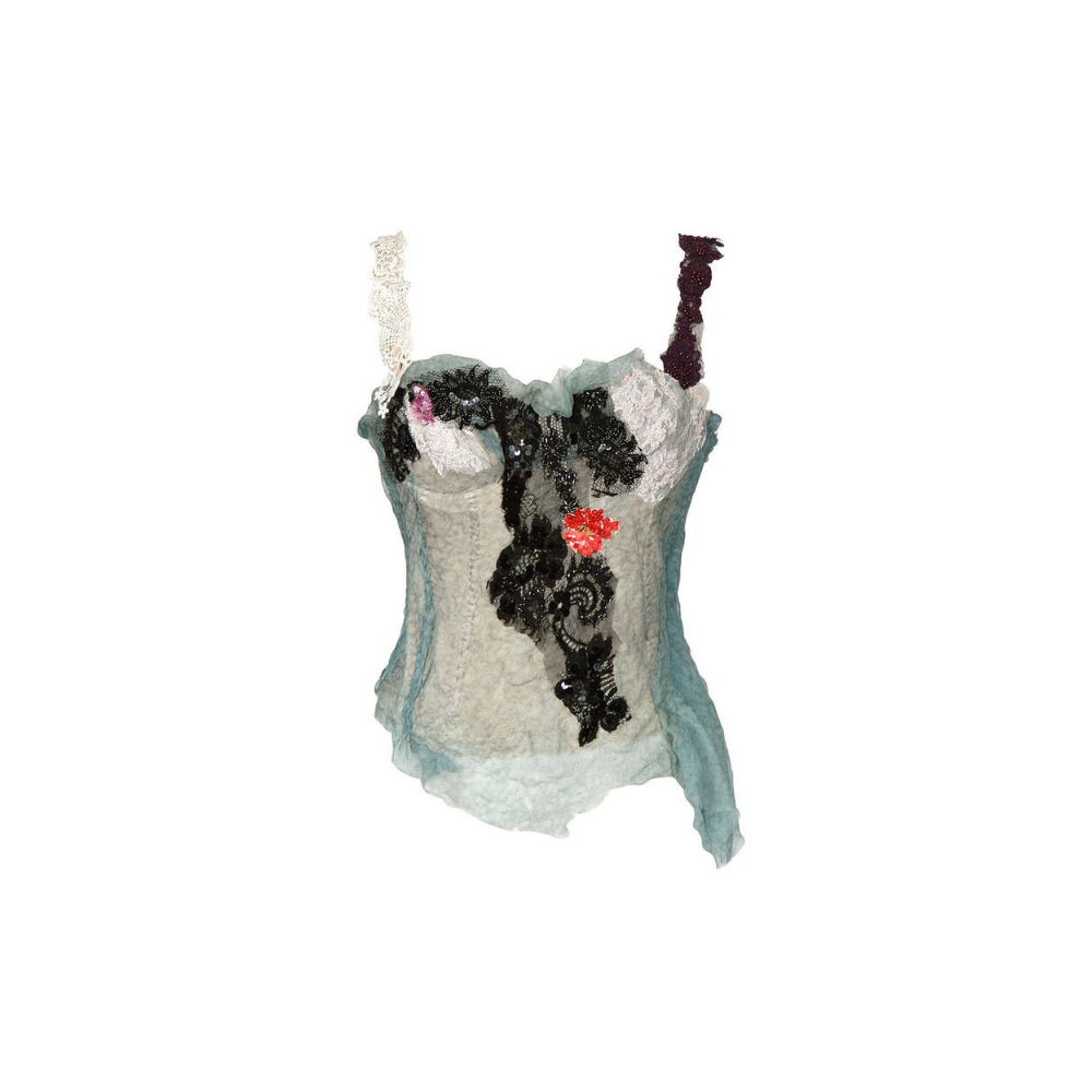 Decorative ornament resembling a corset with a cat design on a white background