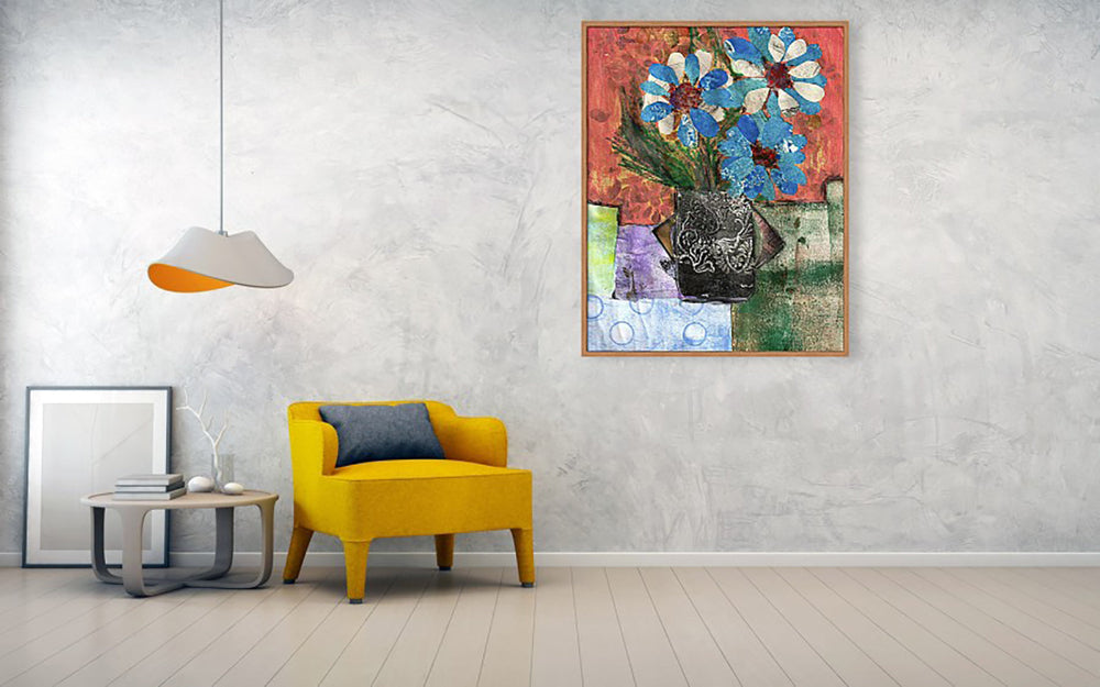 Mixed media collage titled Cold Moon from the Moon series by Sara Palacios. The artwork features vibrant blue and white flowers in a dark, textured vase set against a warm red background, with layered geometric shapes and fabric-like patterns beneath.