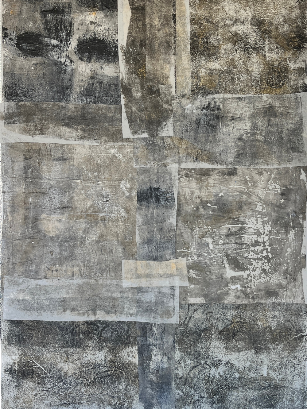 Abstract art piece with a patchwork of gray, black, and beige colors.
