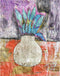 Decorative vase with blue flowers on a textured surface with abstract patterns