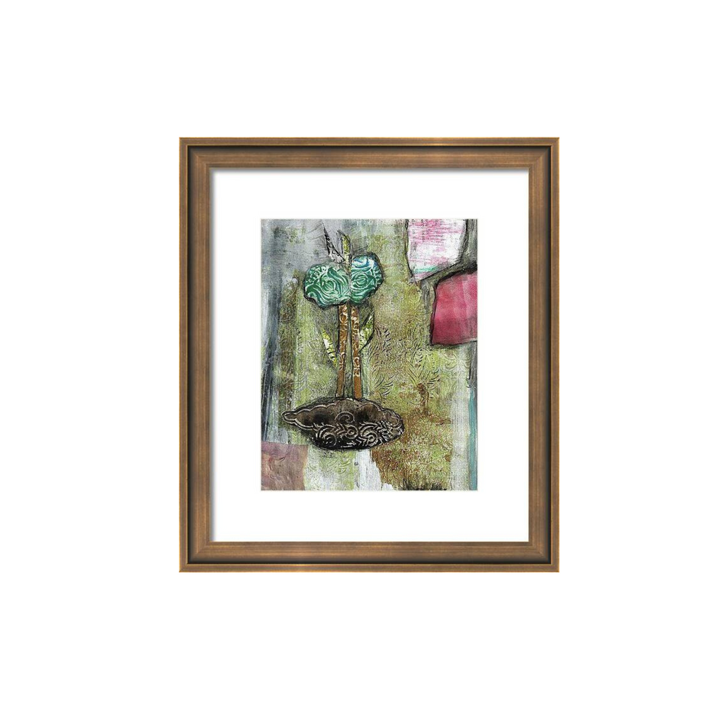 Framed artwork with a decorative object on a white background