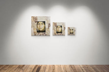 Textile art portrait of a woman’s face printed on fabric and stitched into a patchwork of vintage-inspired textiles in beige and gold tones.