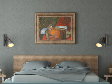 Bedroom with wooden headboard, gray bedding, and framed painting on gray wall.