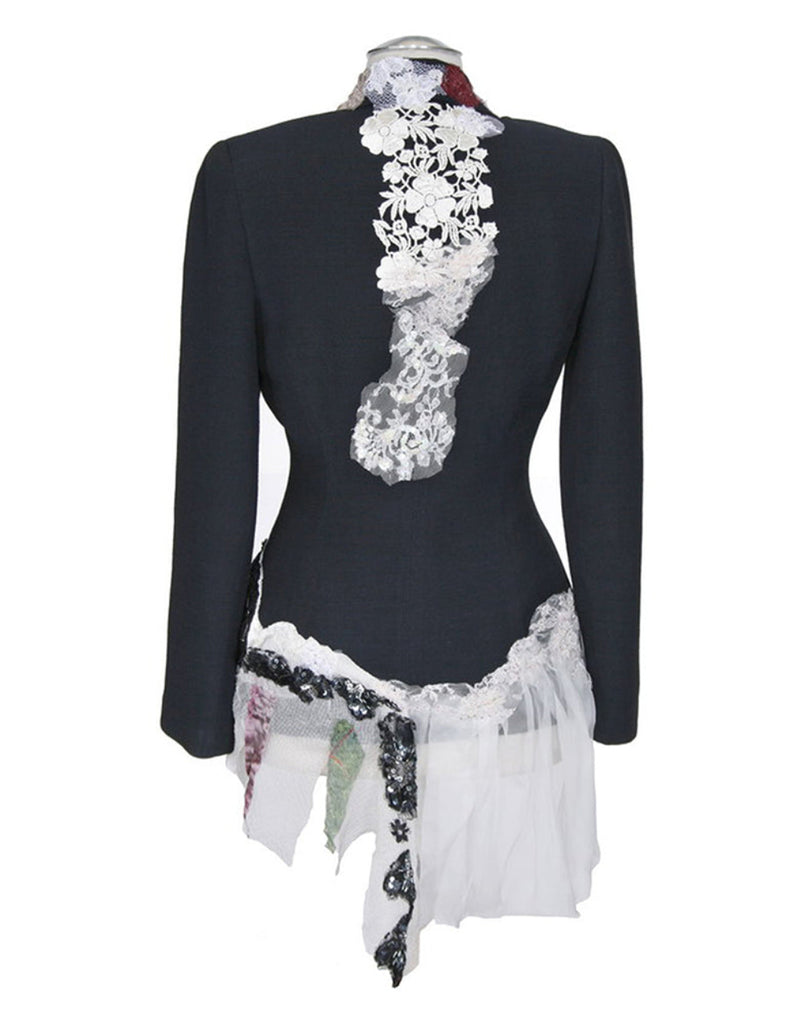 Art print of a couture jacket titled Madeline Jacket, created by Sara Palacios with white floral lace, sheer fabric, and black sequined detailing.

