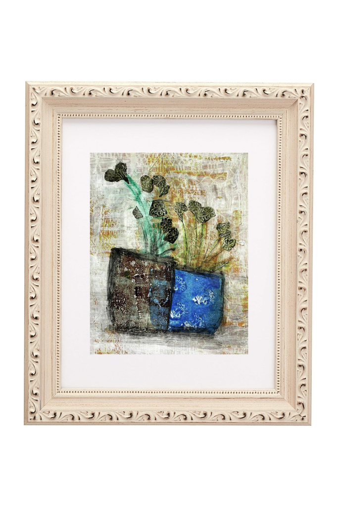 Framed abstract artwork with a blue pot and green plants on a white background