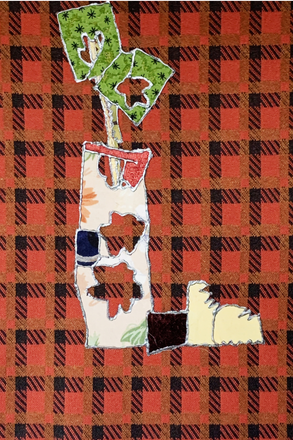 Decorative sign with cut-out letters on a red and black plaid background