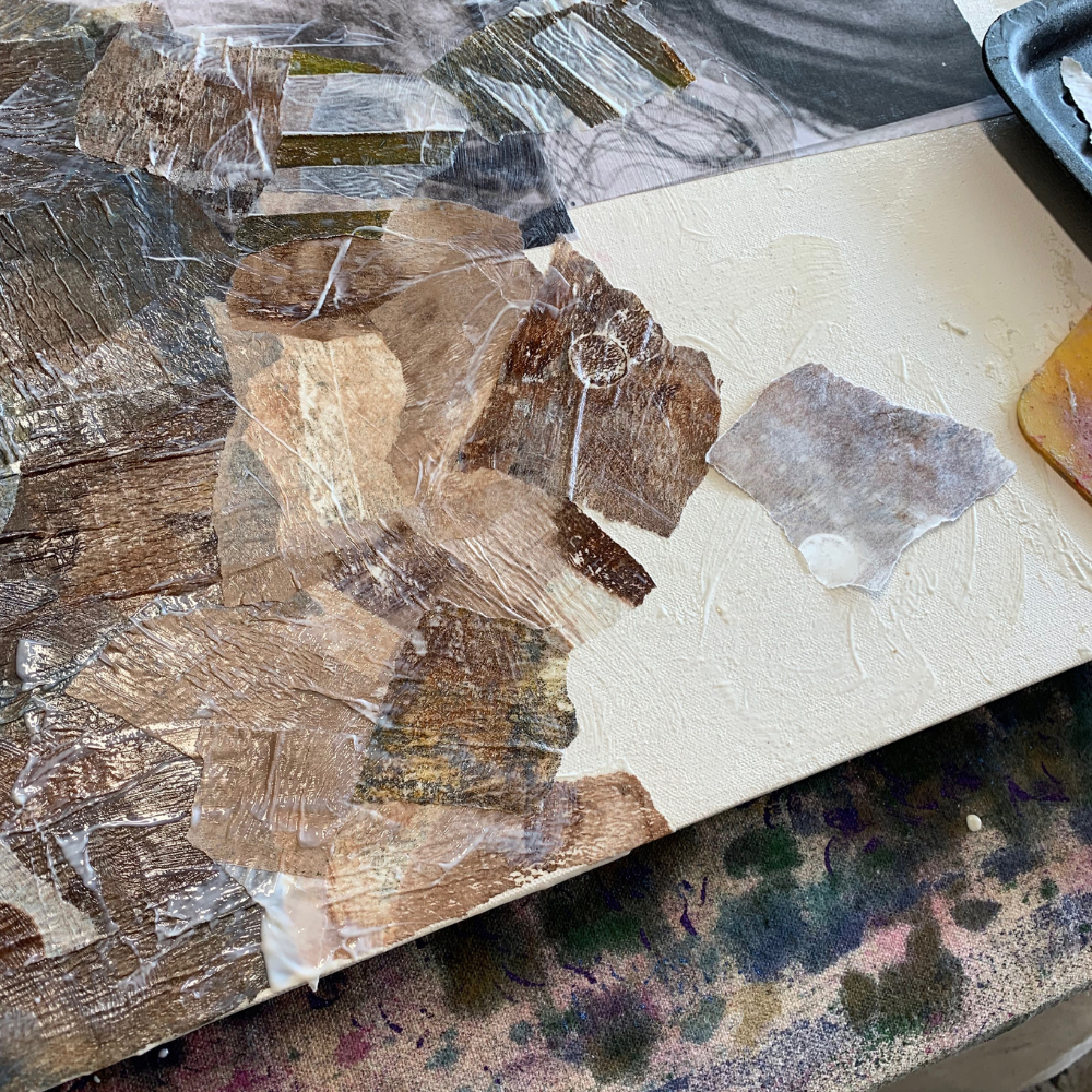 Close-up of a fossil embedded in a rock on a marble surface