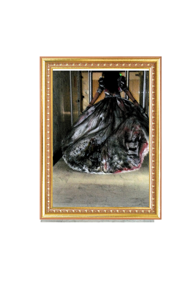 Framed artwork of a black dress with gold frame