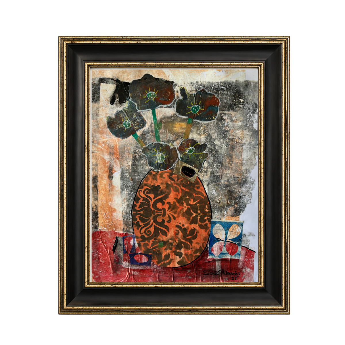 Framed abstract art print featuring a stylized orange and black patterned vase with dark flowers on a textured multicolor background, enclosed in a black and gold frame.