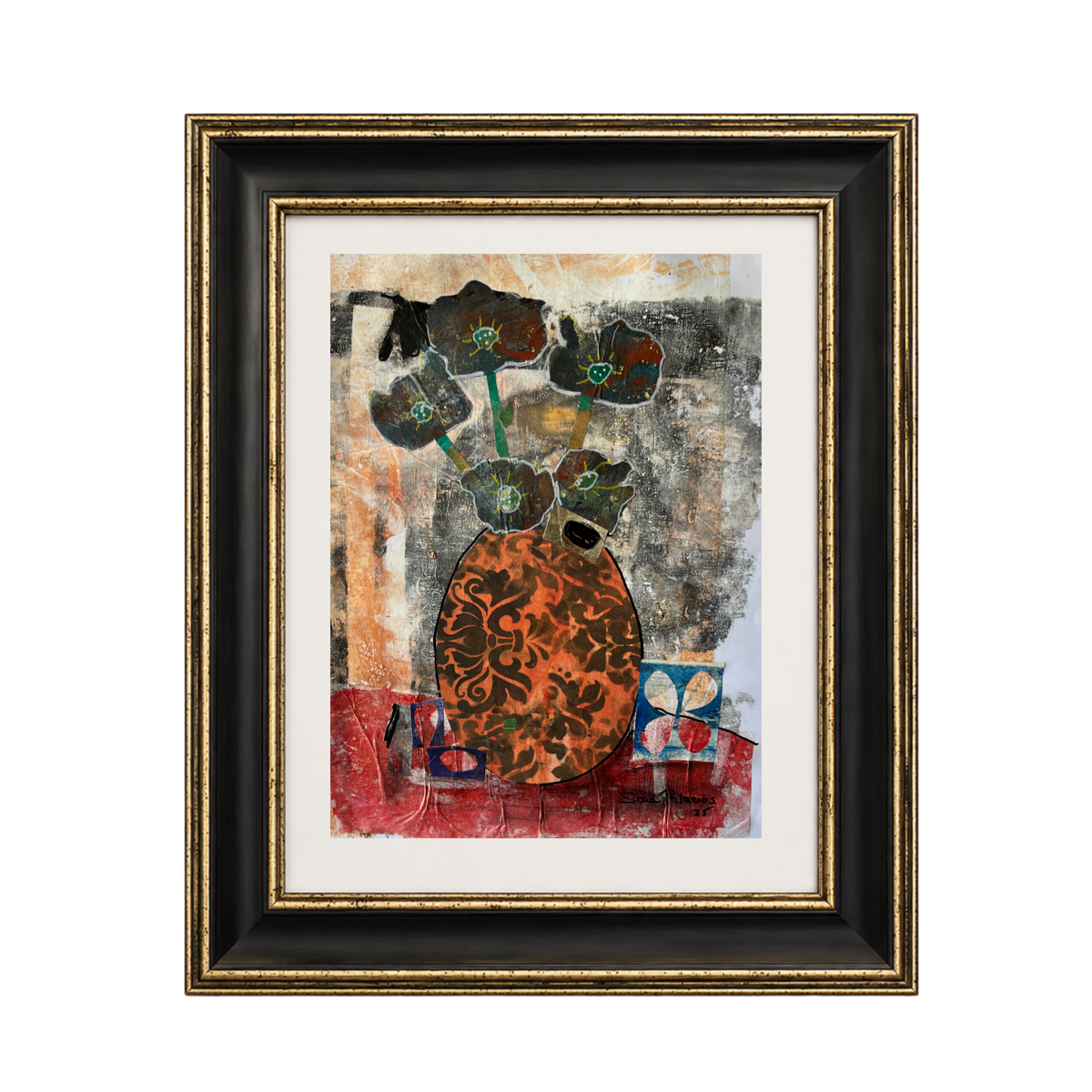 Framed abstract art print featuring a stylized orange and black patterned vase with dark flowers on a textured multicolor background, enclosed in a white mat and a black and gold frame.