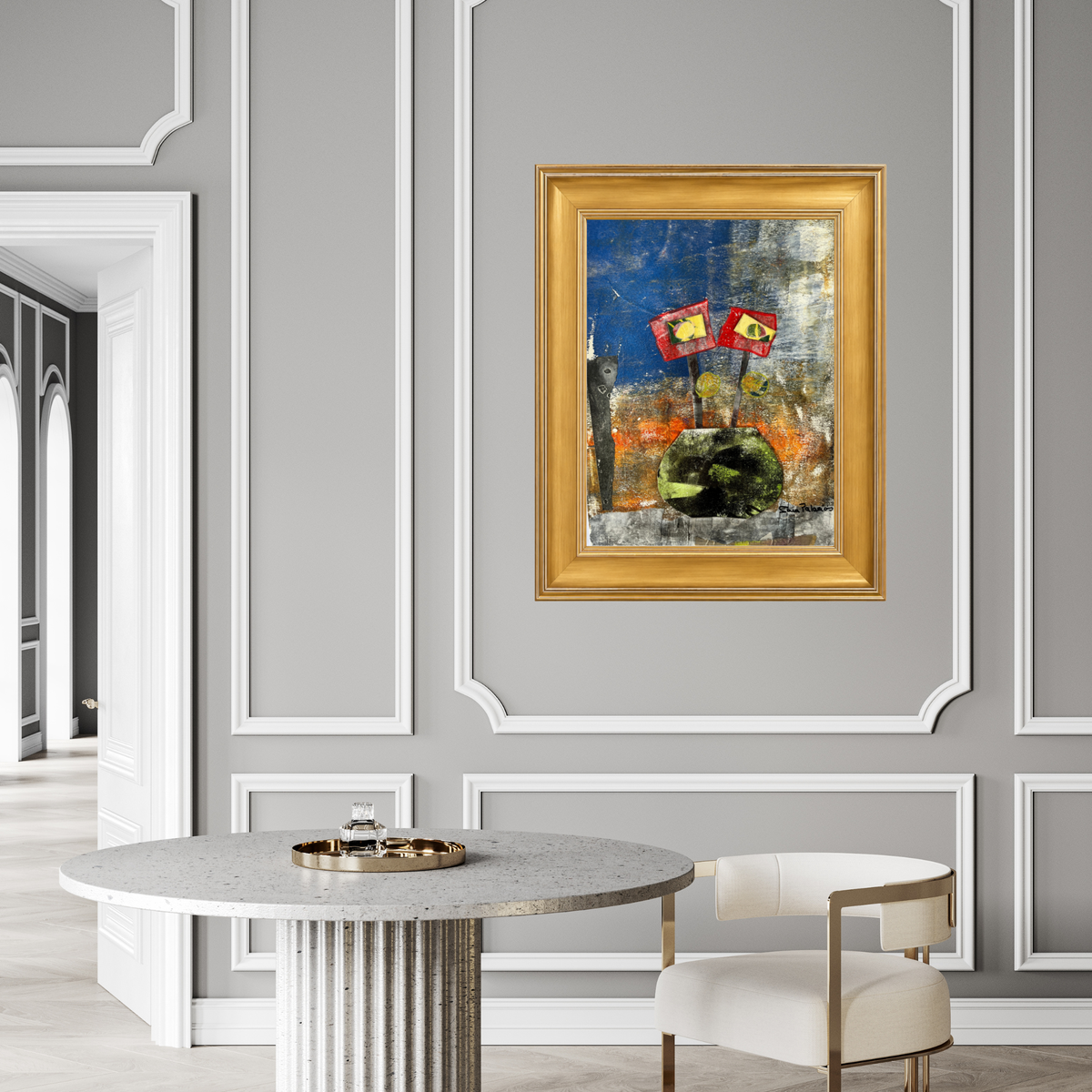 A framed abstract painting featuring a green horse and red-and-yellow flags under a blue sky, displayed on a gray paneled wall above a round table and chair in a modern interior.