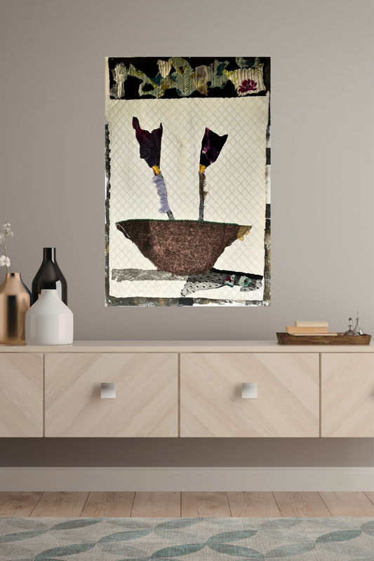 Abstract art piece on a wall above a wooden cabinet with decorative items.
