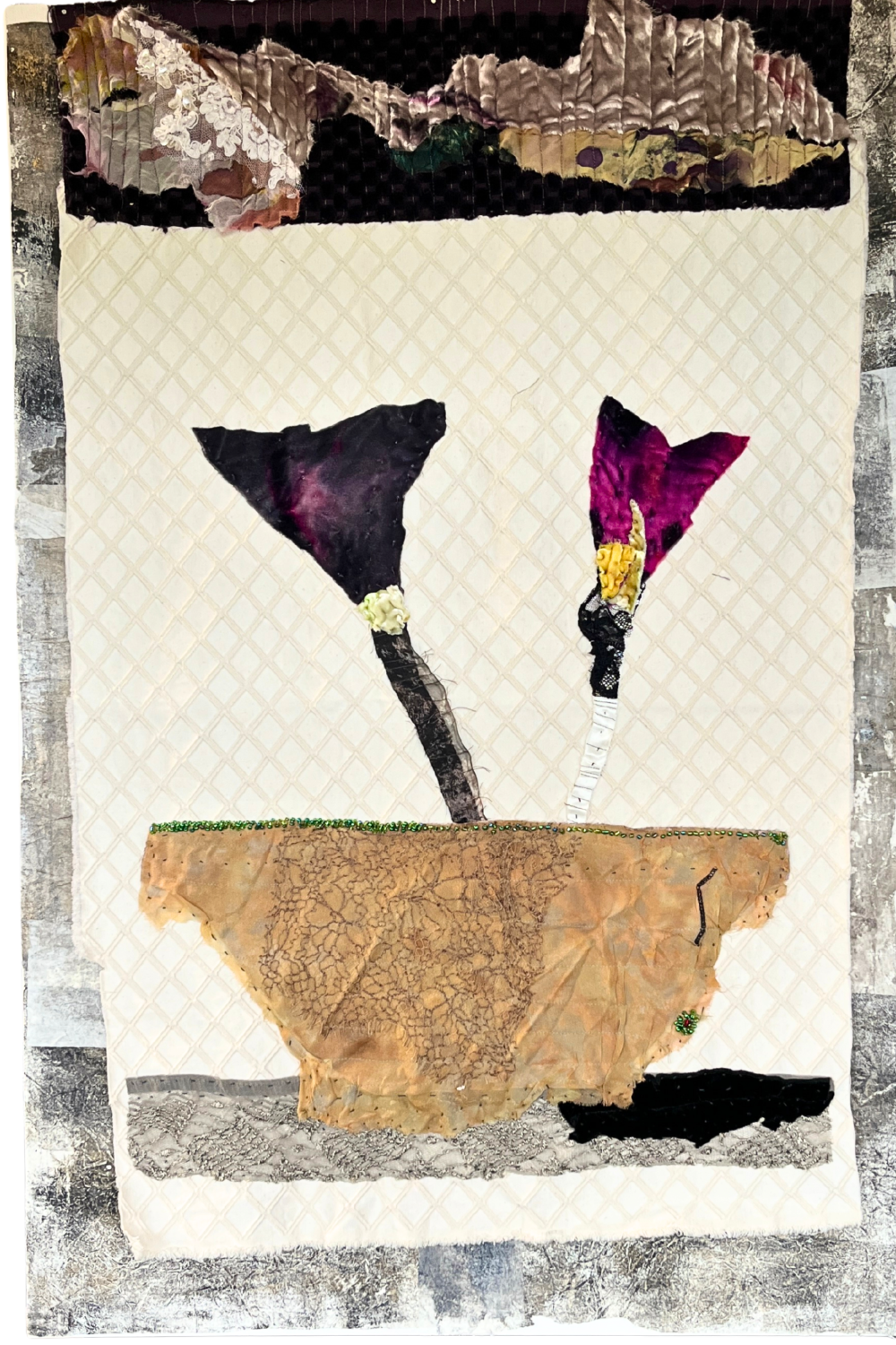 Artistic quilt with floral design and textured background