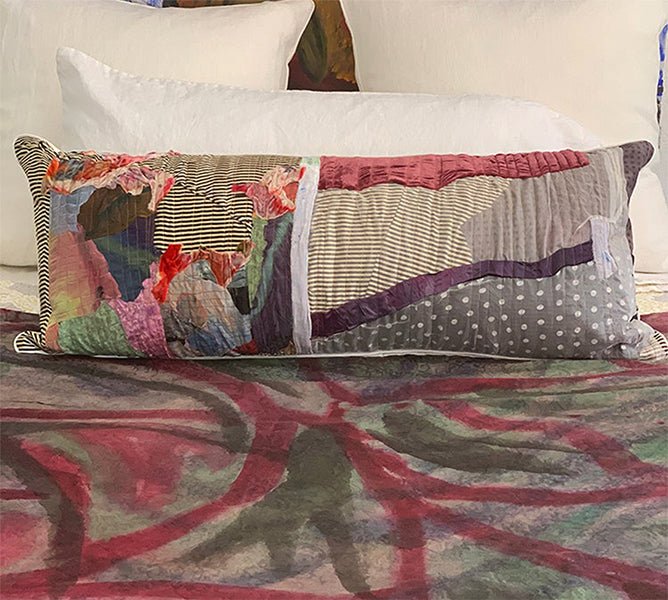 Handcrafted abstract patchwork lumbar pillow by Sara Palacios, made with hand-painted fabrics and textile collage, decorative bedding accent.