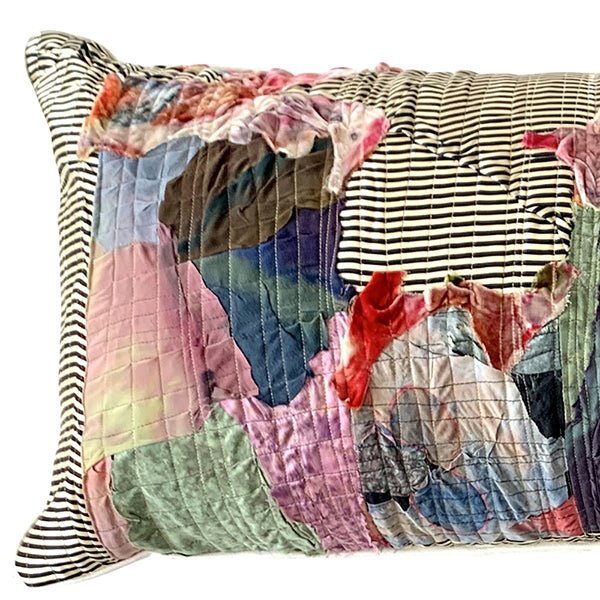 Handcrafted abstract patchwork lumbar pillow by Sara Palacios, made with hand-painted fabrics and textile collage, decorative bedding accent.