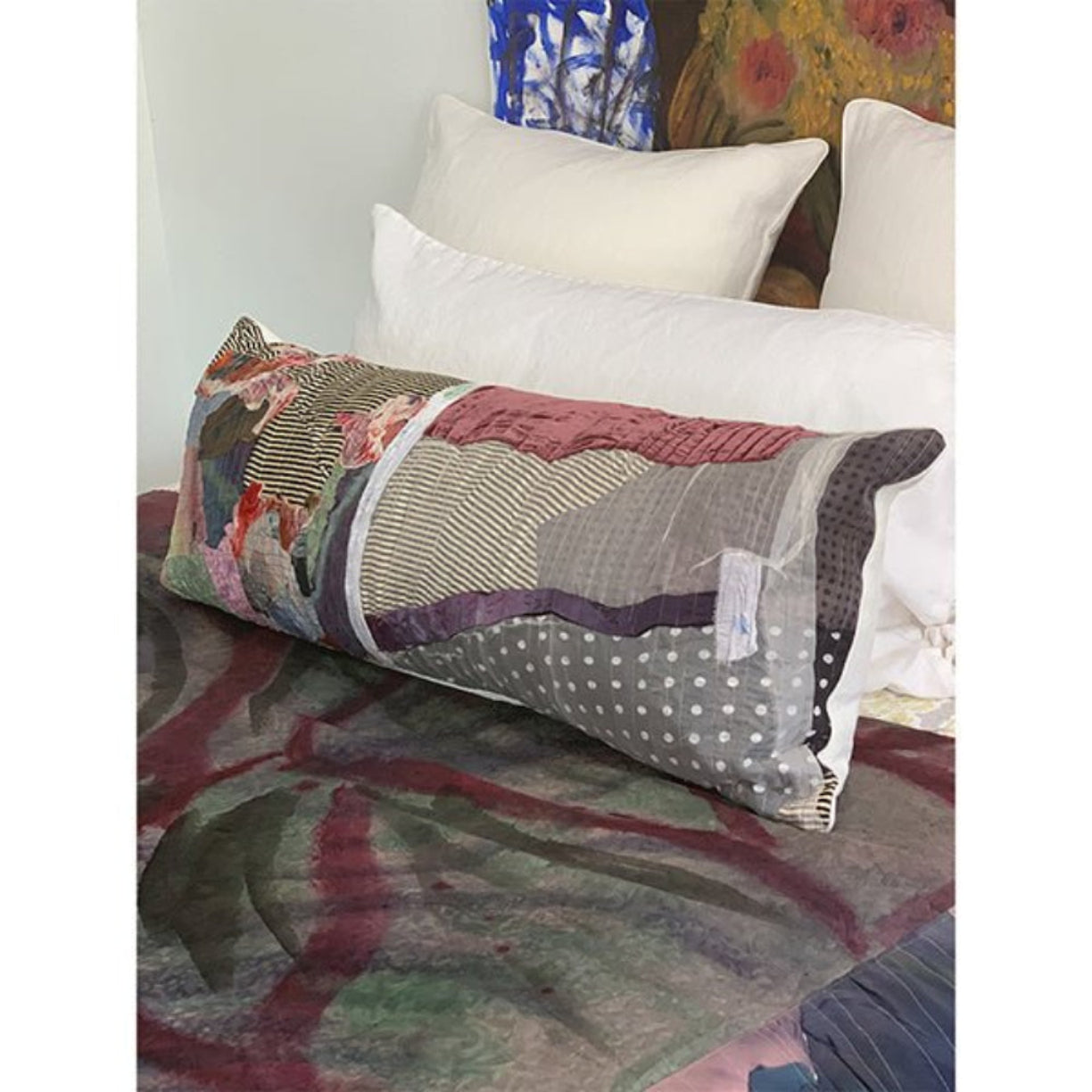 Handcrafted abstract patchwork lumbar pillow by Sara Palacios, made with hand-painted fabrics and textile collage, decorative bedding accent.